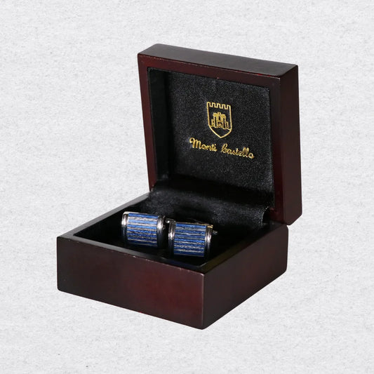 Blue and silver cross-grain cufflinks in a wooden box with Monti Castello logo