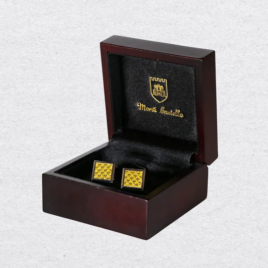 Gold square cufflinks in a wooden box with Monti Castello logo
