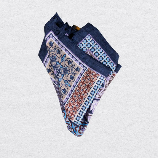 Lilac and blue mosaic pattern on silk pocket square, folded into a point