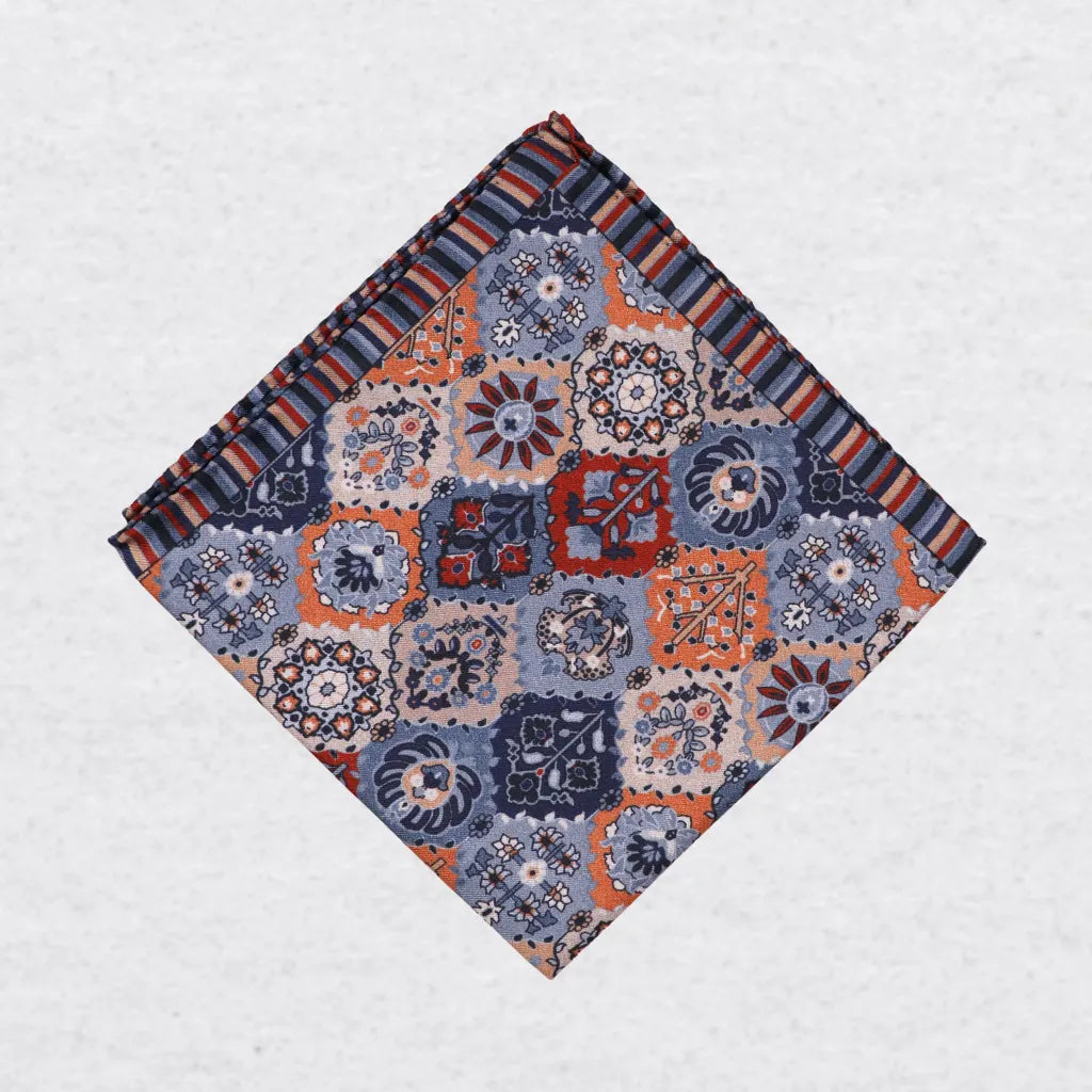 Monti Castello silk pocket square, playful patchwork, folded presentation
