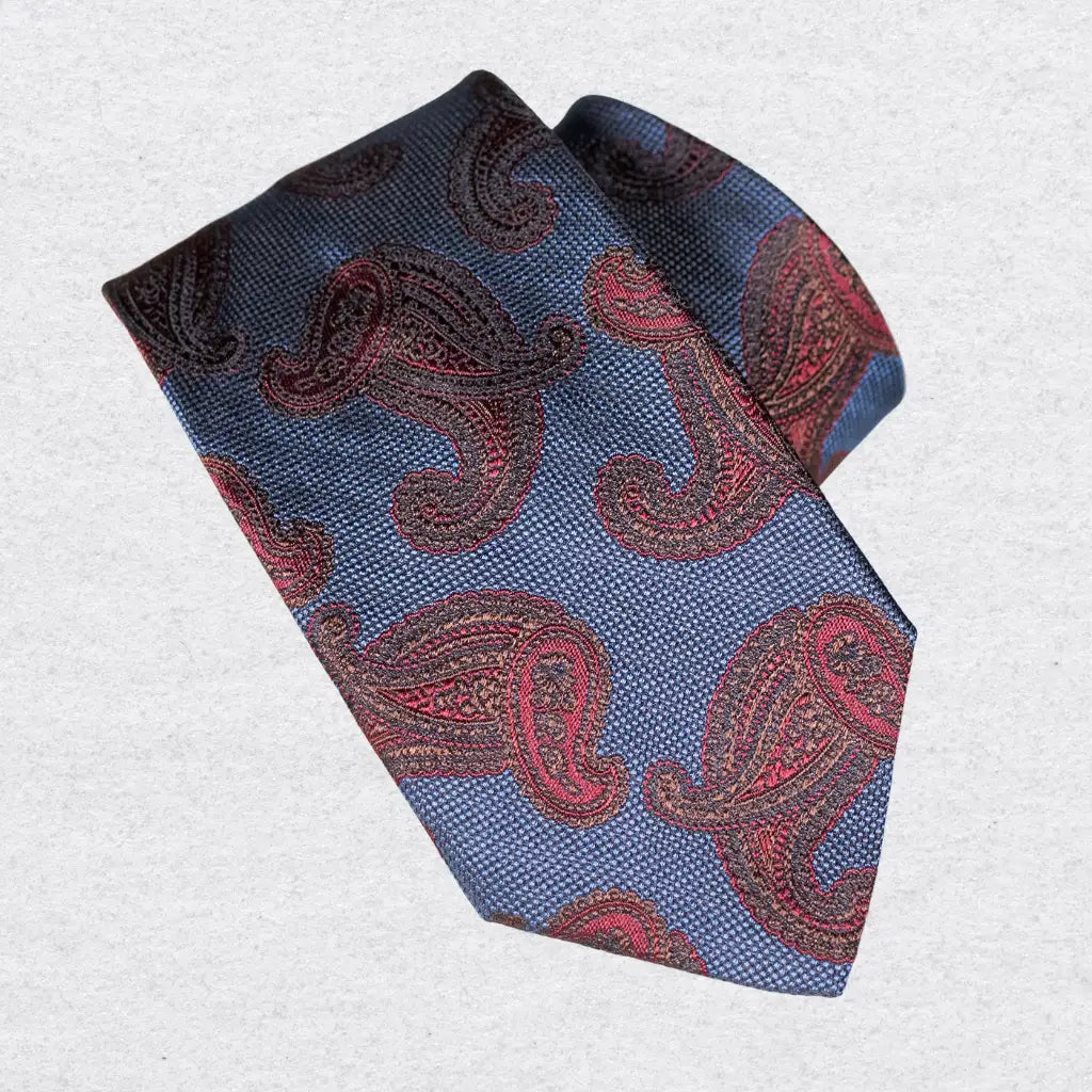 Blue tie with red paisley pattern on a white background