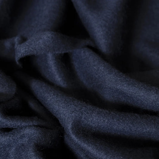 Close-up of dark blue cashmere fabric texture