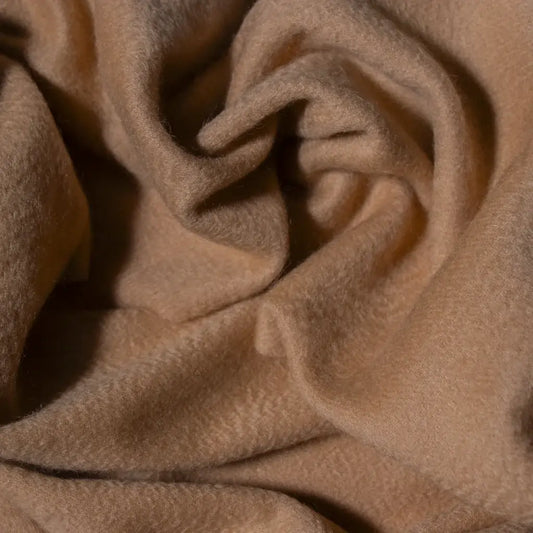 Close-up of camel cashmere scarf with soft folds
