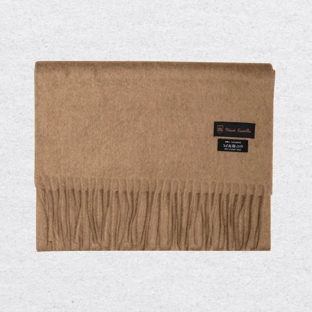 Beige camel scarf with a Monti Castello label on a light gray background