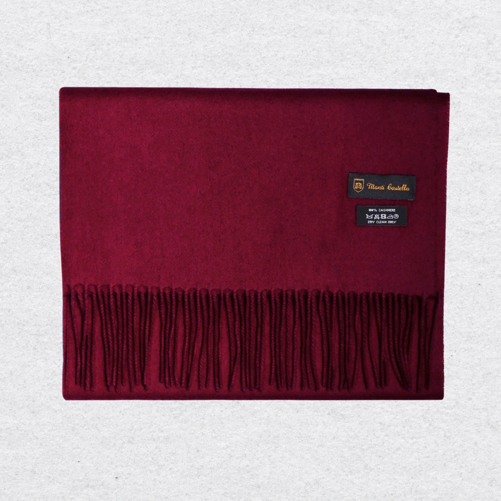 Burgundy scarf with a Monti Castello label on a light gray background
