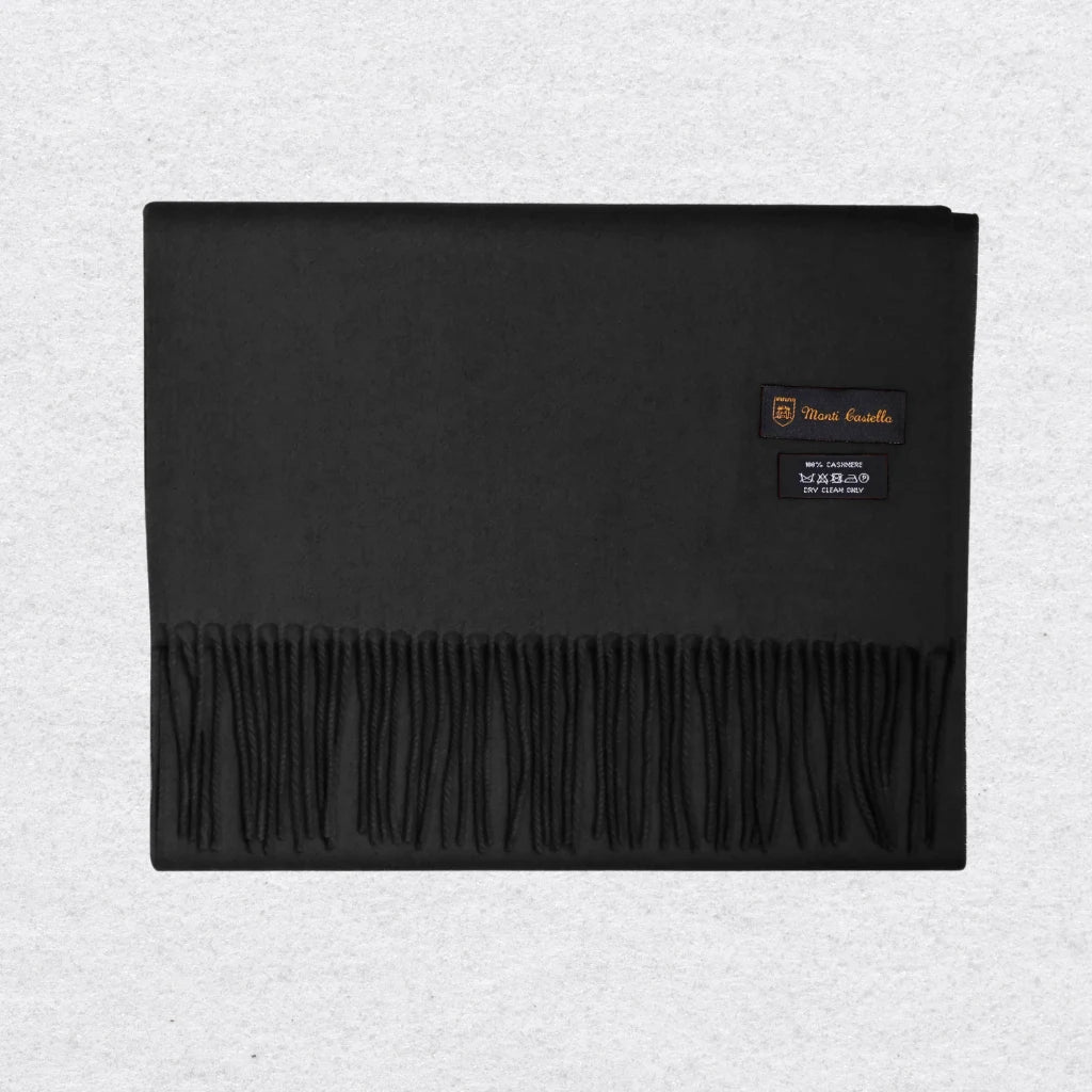 Black scarf with Monti Castello label on a light gray background