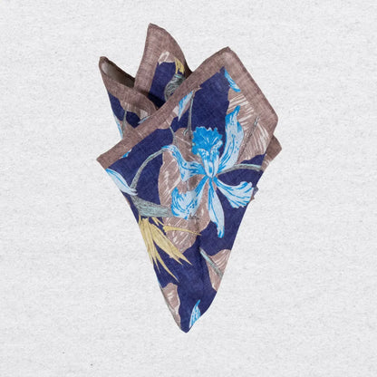 Brown and navy pocket square in linen on a grey background