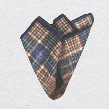 Check pocket square with blue and brown colours folded on a light background