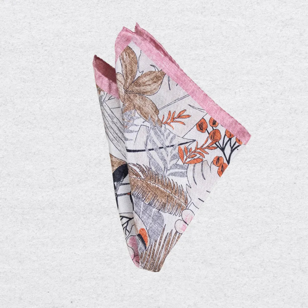 Folded silk pocket square with pink edging and colourful bird pattern