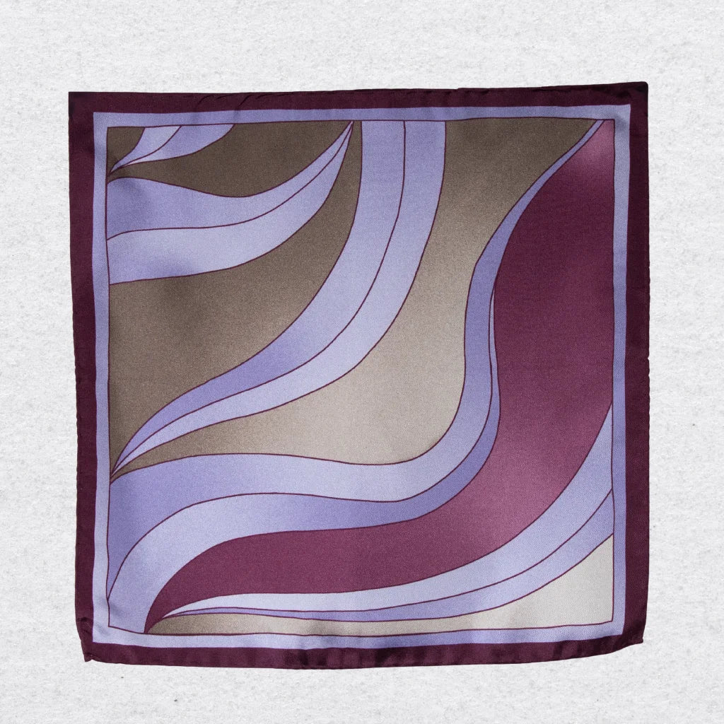 Silk pocket square with wavy pattern in deep purple, champagne, and lilac on a grey background
