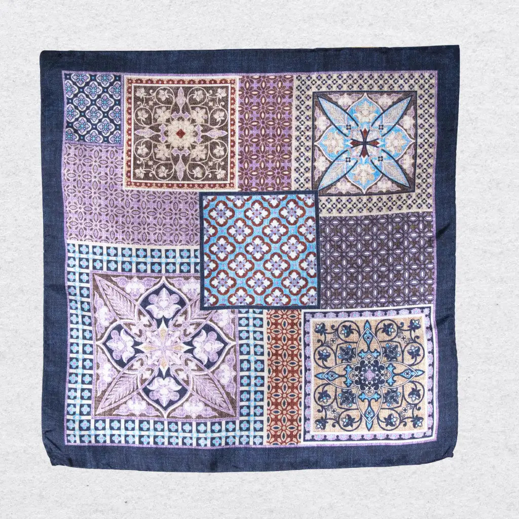 Patterned fabric pocket square with Mosaic geometric and floral designs on a grey background