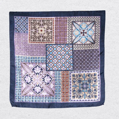 Patterned fabric pocket square with Mosaic geometric and floral designs on a grey background