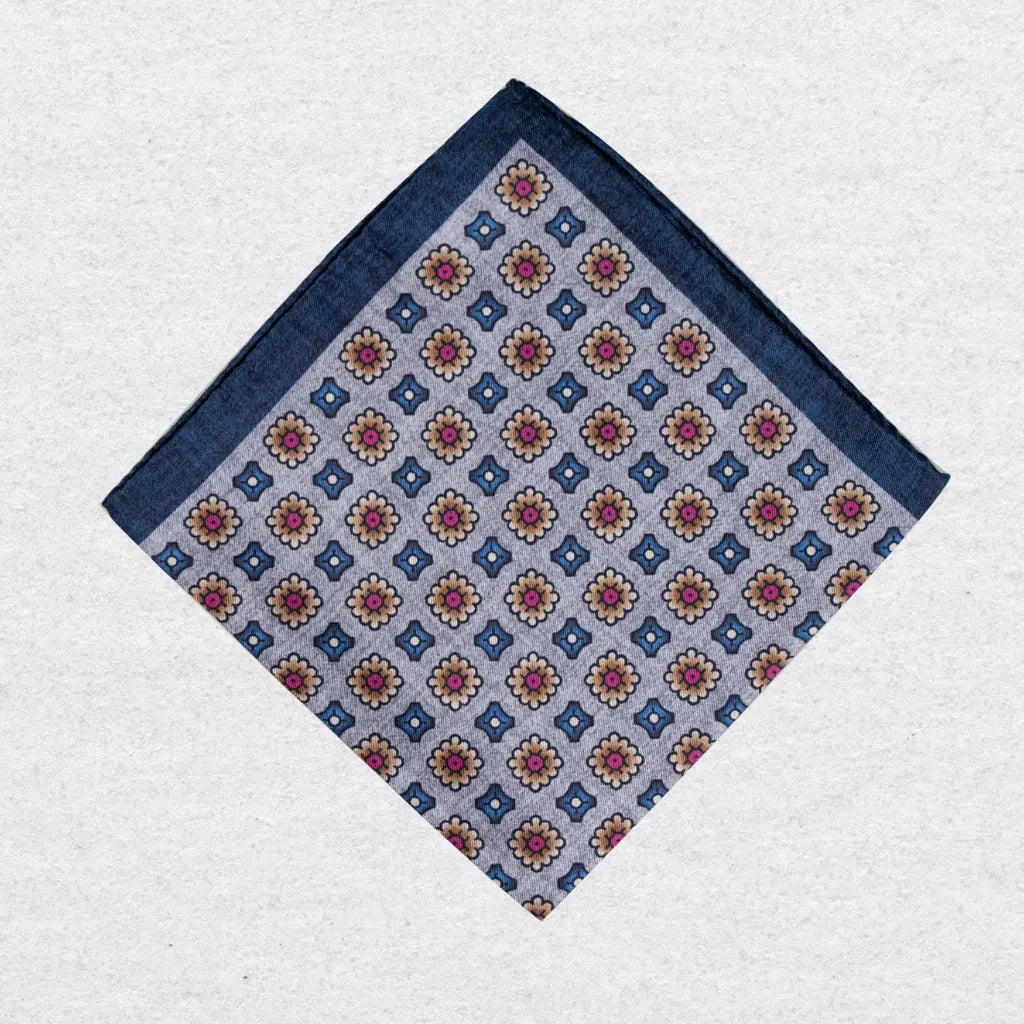 Medallion print pocket square on a grey background