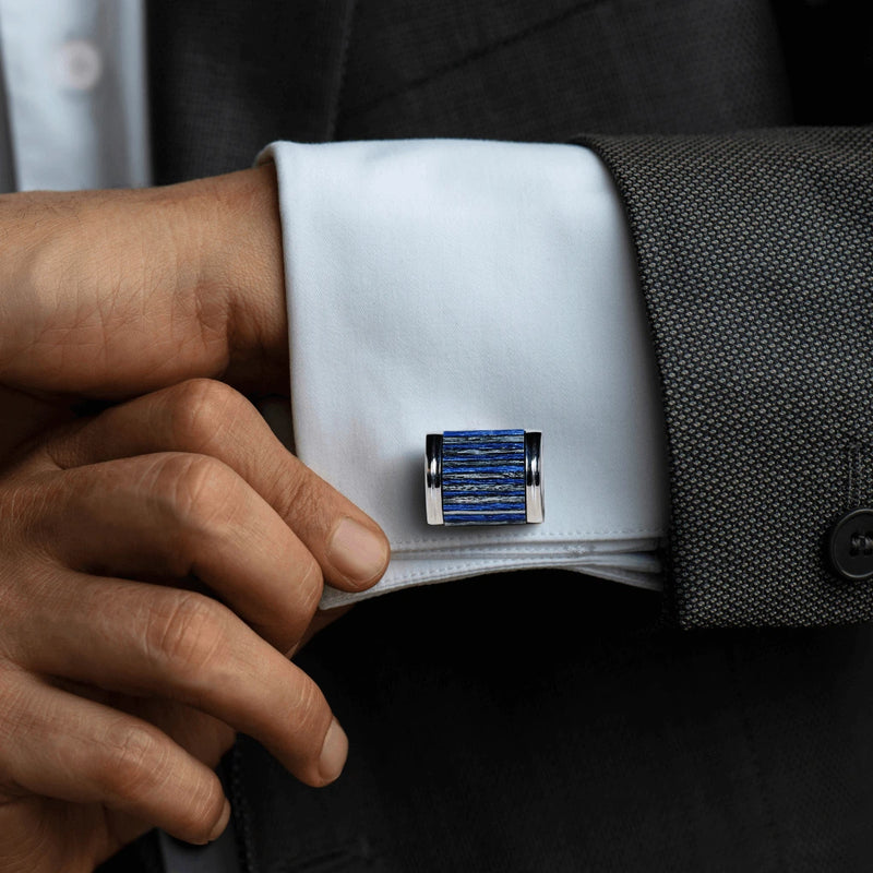 Monti Castello cufflink on a cuff of a suit with a hand adjusting it