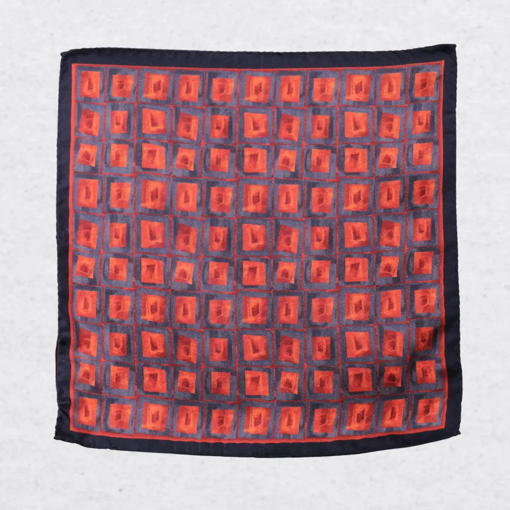 Orange and blue geometric squares on a silk pocket square