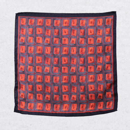 Orange and blue geometric squares on a silk pocket square
