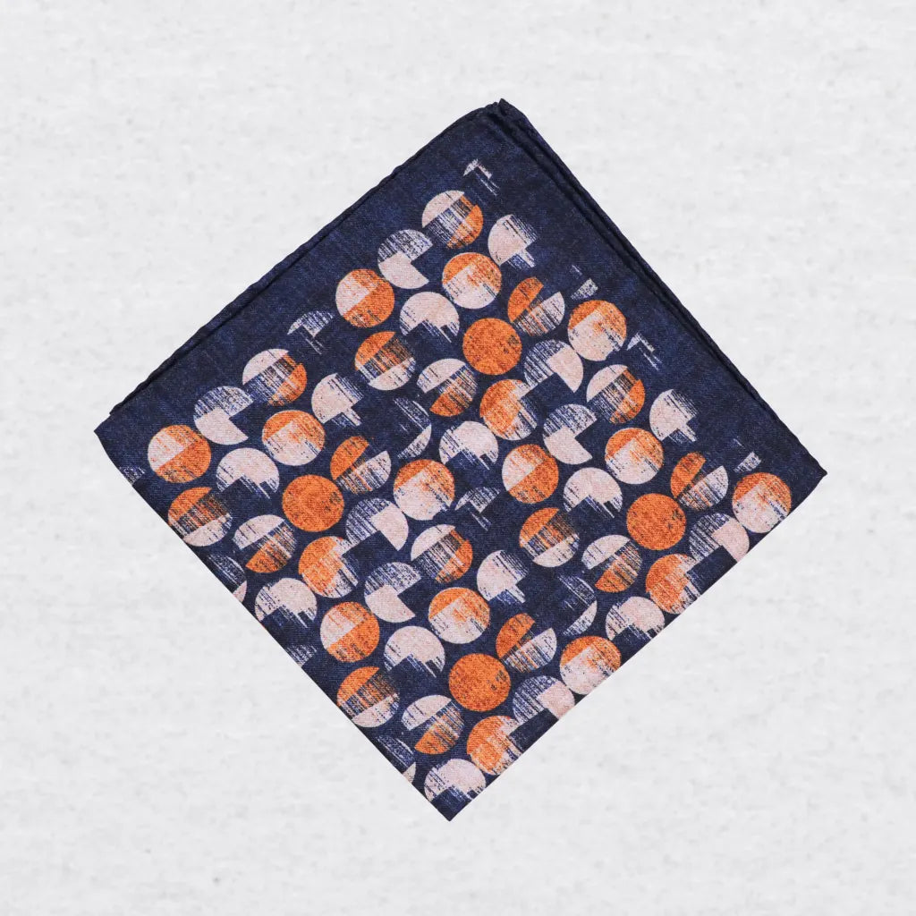 Monti Castello silk pocket square, navy terracotta bubble design, folded presentation