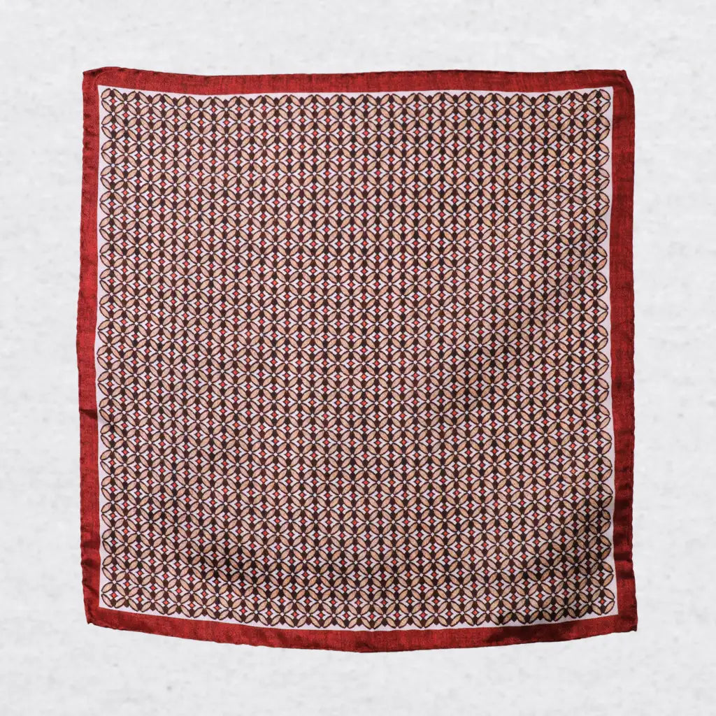 Monti Castello silk pocket square, burnt orange camel geometric, flat lay