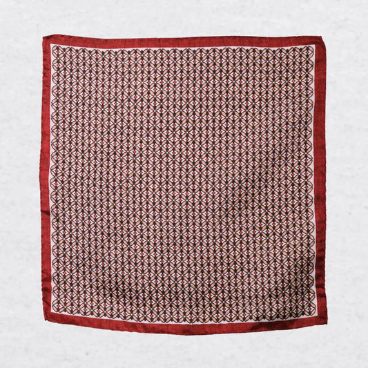 Monti Castello silk pocket square, burnt orange camel geometric, flat lay