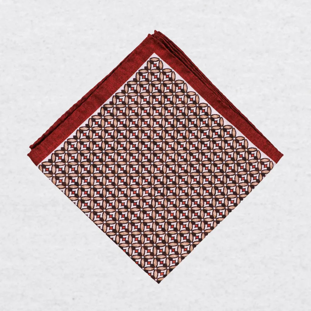 Monti Castello silk pocket square, burnt orange camel geometric, folded presentation