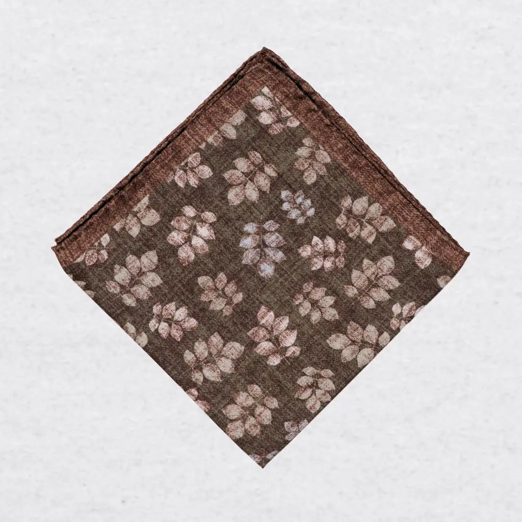Monti Castello silk pocket square, khaki brown leaf print, folded presentation