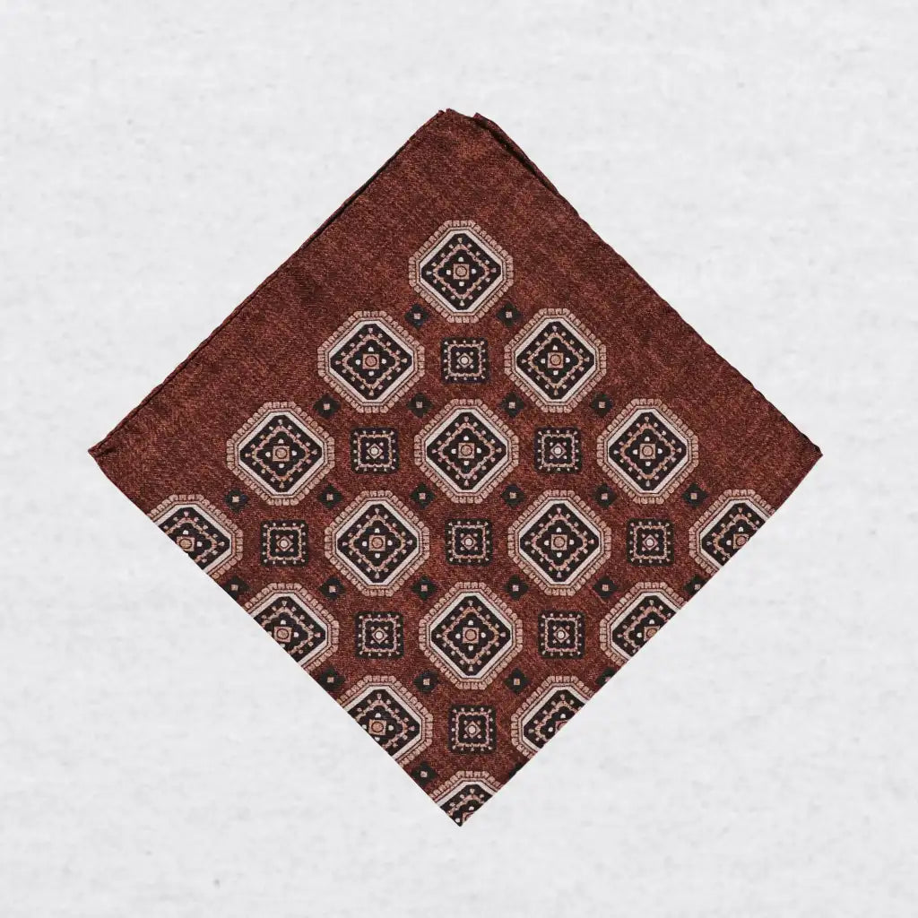 Monti Castello silk pocket square, cinnamon navy square medallion, folded presentation