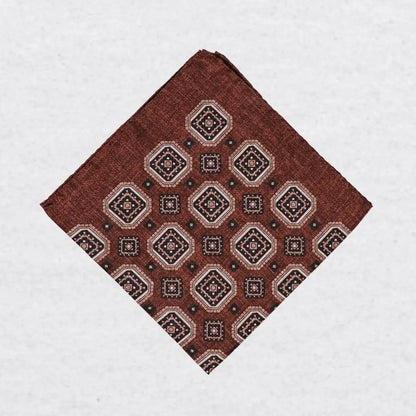 Monti Castello silk pocket square, cinnamon navy square medallion, folded presentation