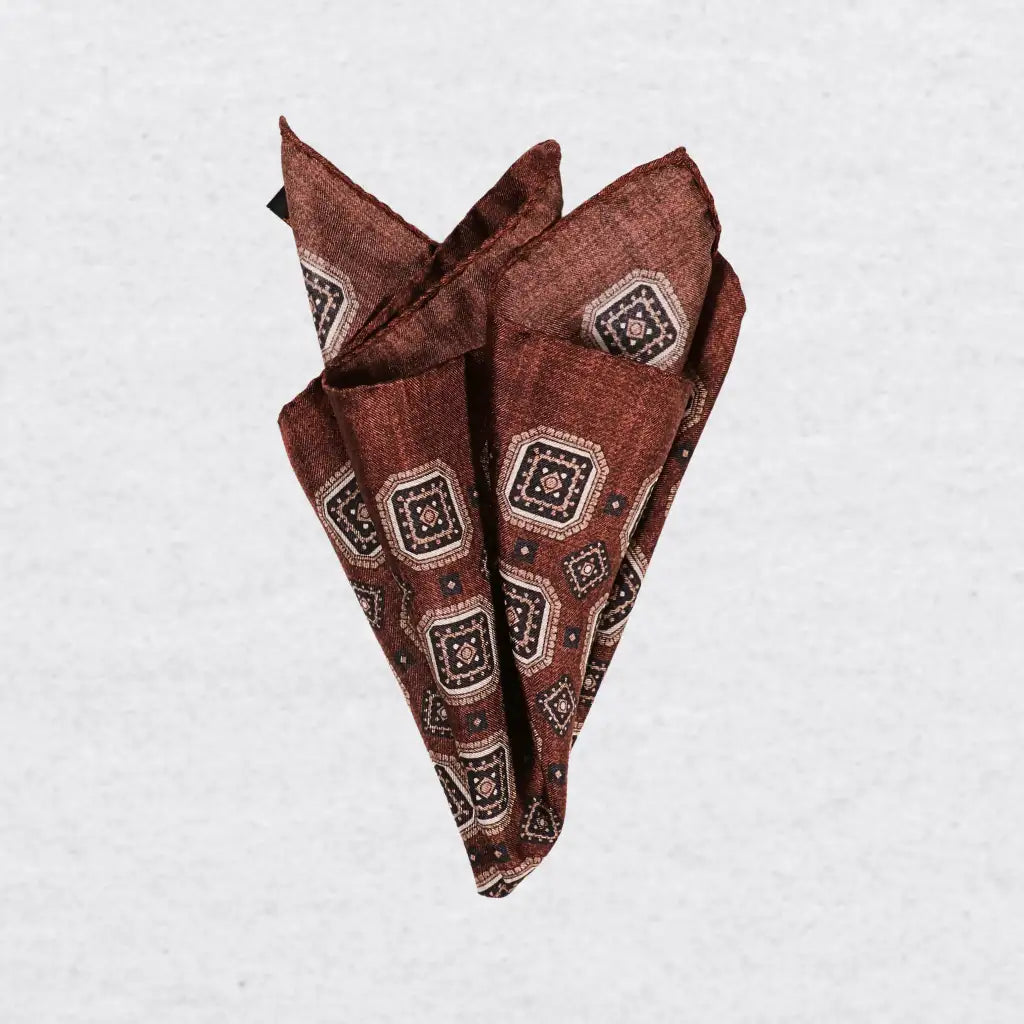 Monti Castello silk pocket square, cinnamon navy square medallion, pinched fold