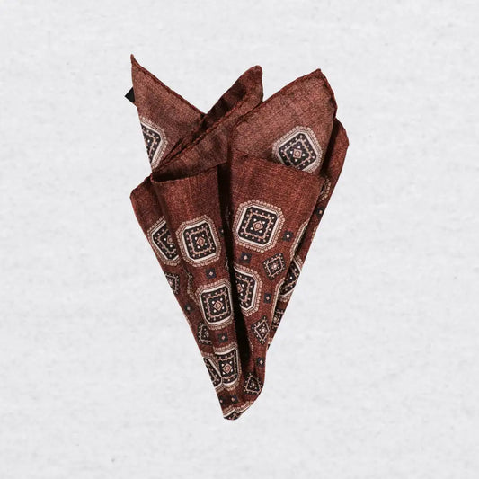 Monti Castello silk pocket square, cinnamon navy square medallion, pinched fold