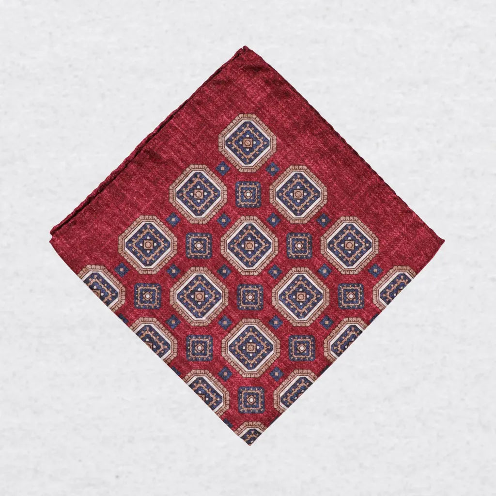 Monti Castello silk pocket square, bordeaux camel square medallion, folded presentation