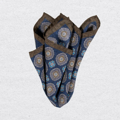 Dark blue wool-silk pocket square with a brown trim and coloured medallions