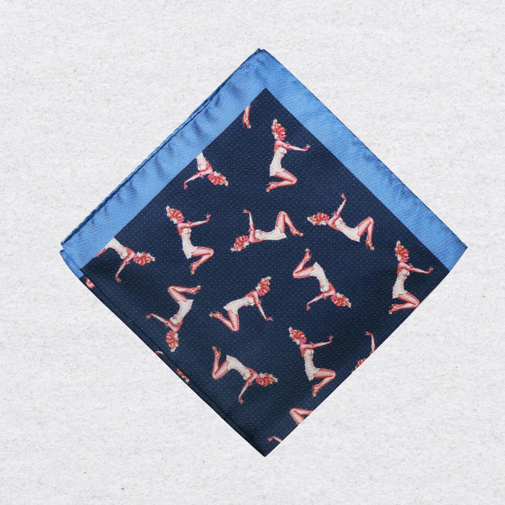 Navy pocket square with pink pin-up girl pattern on a grey background