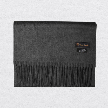 Gray cashmere scarf with a Monti Castello label on a light gray background