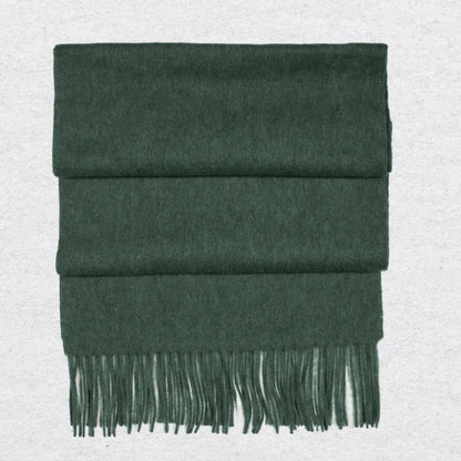 Forest Green cashmere scarf with fringes on a light gray background