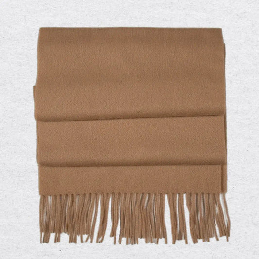 Camel coloured scarf with tassels on a light gray background
