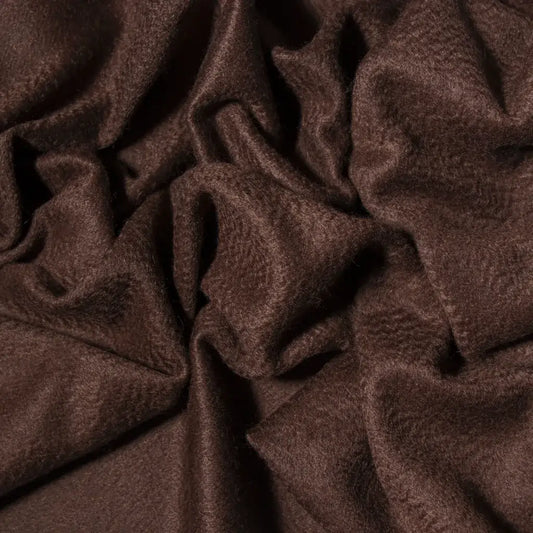 Close-up of brown cashmere fabric with soft folds