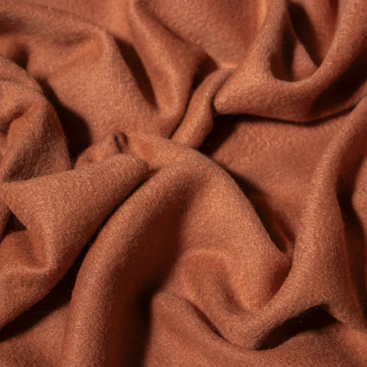 Close up of orange cashmere fabric