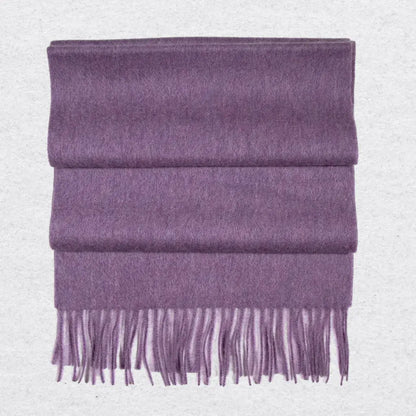Purple cashmere scarf with tassels on a light gray background