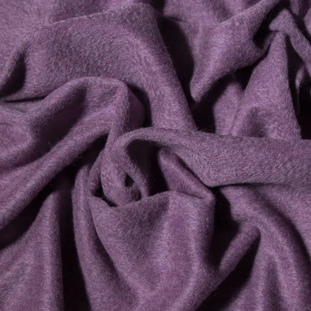 Close-up of lilac cashmere fabric with a soft texture
