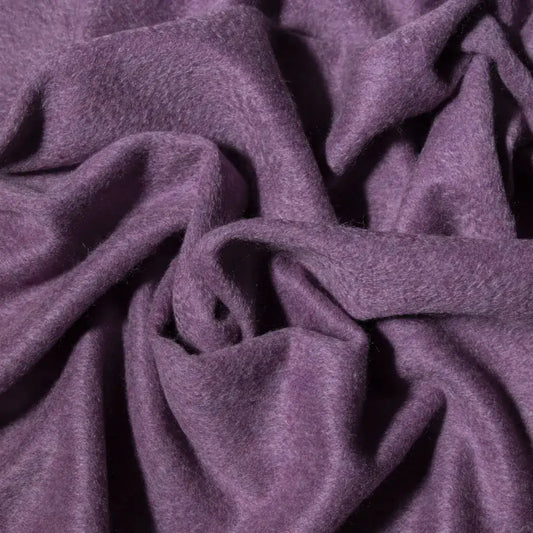 Close-up of lilac cashmere fabric with a soft texture